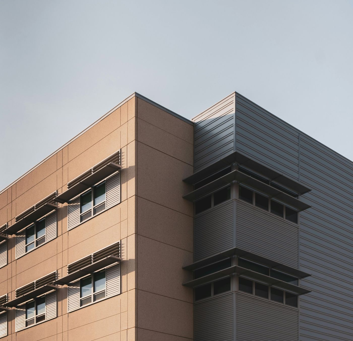 Corner of a modern office building with sun louvres